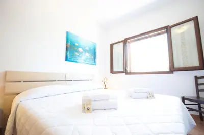 Letto o letti in una camera di Casa delle Sorgenti 2