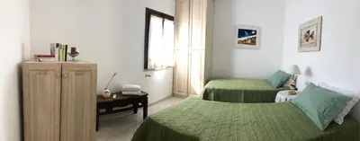 Letto o letti in una camera di B&B Casa Antonietta