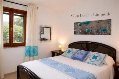 Letto o letti in una camera di Casa Lucia vicino al mare