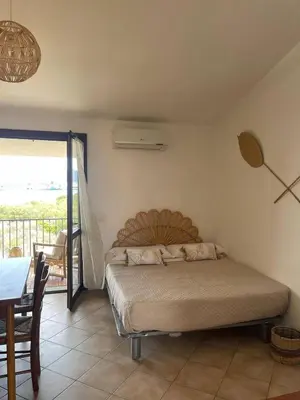 Letto o letti in una camera di Studio Boho by Propertize