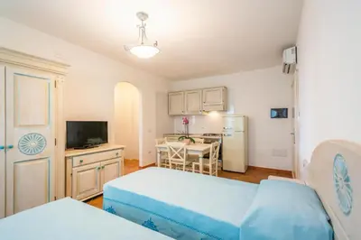 Letto o letti in una camera di Charming Baia Marina Apartments with Stunning View 1 bedroom apartment sleeps 4