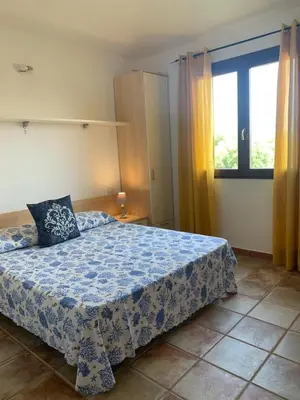 Letto o letti in una camera di Appartamento SAN TEODORO CENTRO