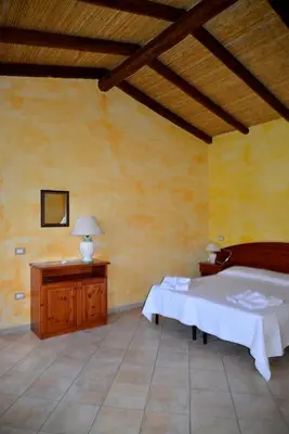 Letto o letti in una camera di Agriturismo Rubinu