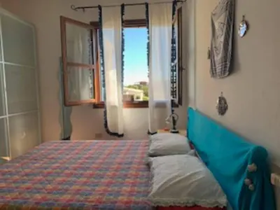 Letto o letti in una camera di CASA MARE Olbia