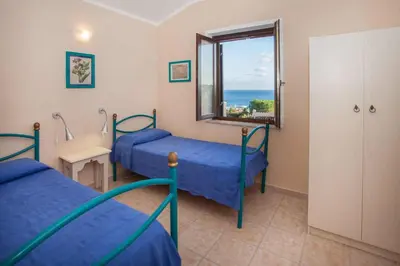 Letto o letti in una camera di Costa Est Apartments