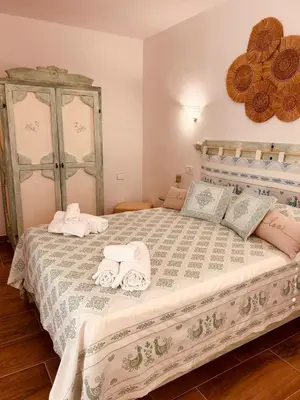 Letto o letti in una camera di Casa Tholos Charme and Relax