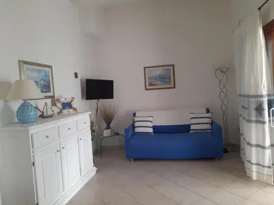 Letto o letti in una camera di Villetta Smeraldo con giardino