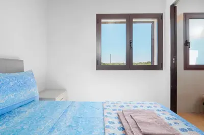 Letto o letti in una camera di Villa Marianna - Almiddina