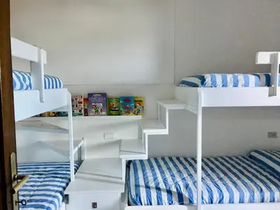 Letto o letti in una camera di Villa Briziola - Puntaldia - vista mare e giardino