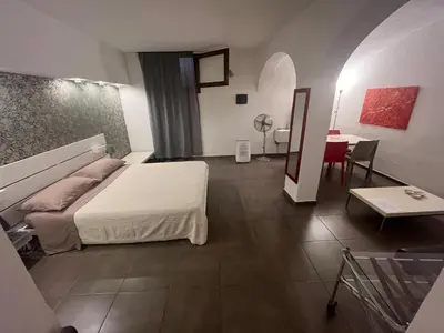 Letto o letti in una camera di Via Romana 1 camera con bagno