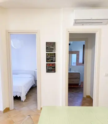 Letto o letti in una camera di Two-room apartment in the heart of Golfo Aranci