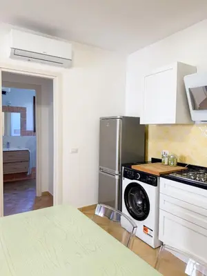 Cucina o angolo cottura di Two-room apartment in the heart of Golfo Aranci