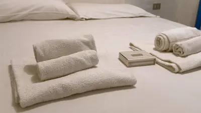 Letto o letti in una camera di Villa Cleopatra