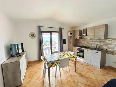 Cucina o angolo cottura di Apartment near Budoni with a sea-view terrace