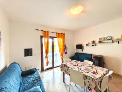 Area soggiorno di Comfortable apartment near Budoni