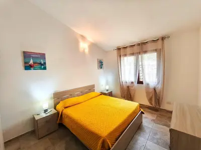 Letto o letti in una camera di Cosy apartment by sea near Budoni