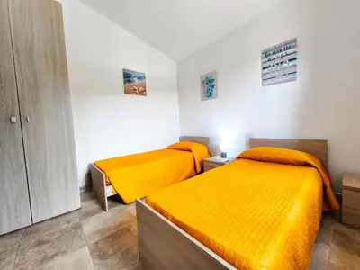 Letto o letti in una camera di Cosy apartment by sea near Budoni