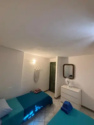 Letto o letti in una camera di Casa Andrea