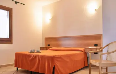 Letto o letti in una camera di Residence Cala Viola