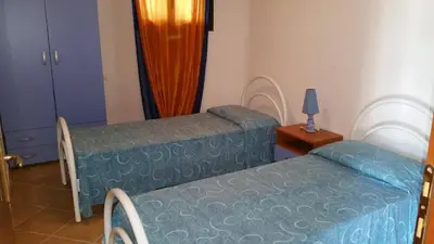 Letto o letti in una camera di Viva Houses San Teodoro
