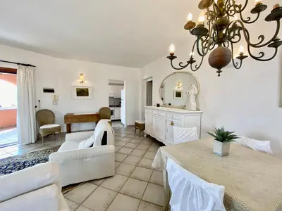 Area soggiorno di ISA - Luxury apartment Ginepro sea view with common swimming pool just 50 mt from the beach