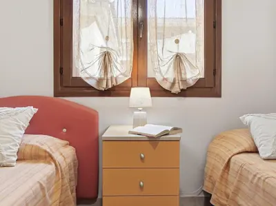 Letto o letti in una camera di Molara apartment by Residence Moresca, frontemare