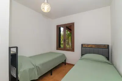 Letto o letti in una camera di Villa La Dolce Teodoro - Spacious Family Villa Near Beaches & Center