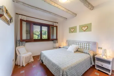Letto o letti in una camera di Villa Antonina