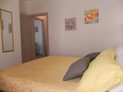 Letto o letti in una camera di Appartamenti Village Ottiolu
