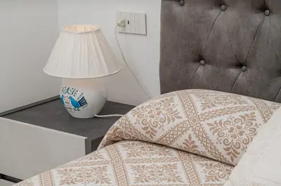 Letto o letti in una camera di Casa vacanza Cala Saccaia