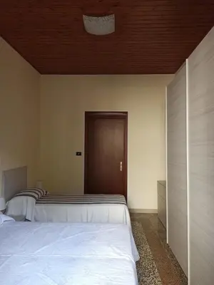 Letto o letti in una camera di Casa Vacanze AnnaLù IUN R5074