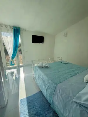 Letto o letti in una camera di Il Giardino delle Fate