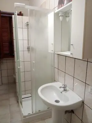 Bagno di Olbia family room con bagno comune