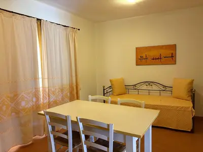 Letto o letti in una camera di MARINELLA RESIDENCE Holiday