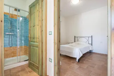 Letto o letti in una camera di Sardinian flat close to stunning beaches
