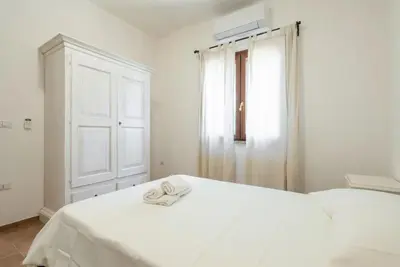 Letto o letti in una camera di Sardinian flat close to stunning beaches
