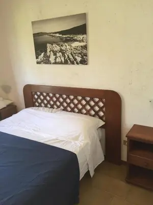 Letto o letti in una camera di Appartamenti Baia Smeralda