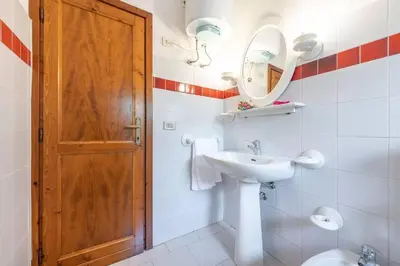Bagno di San Teodoro flat steps from the beach