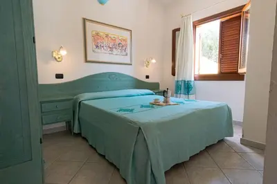 Letto o letti in una camera di Apartment with shared pool