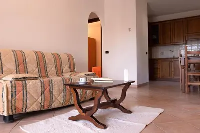 Area soggiorno di Spacious apartment with shared pool
