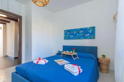 Letto o letti in una camera di Il Vecchio Faro Carolina - Happy Rentals