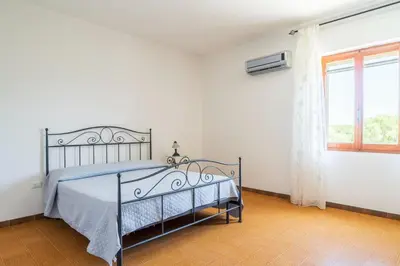 Letto o letti in una camera di Villa Antonina & Mino