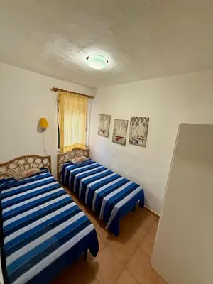 Letto o letti in una camera di Villa Melograno