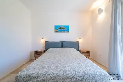 Letto o letti in una camera di Villa Millelune - by Searly
