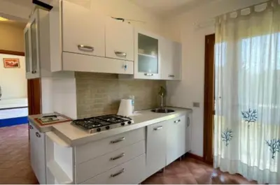 Cucina o angolo cottura di Casa vacanza San Teodoro