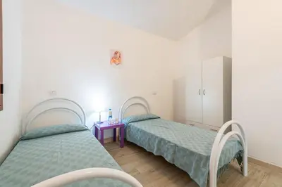 Letto o letti in una camera di AffittaSardegna - Appartamenti Appentos