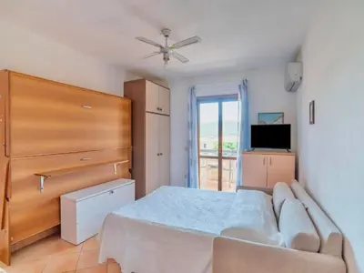 TV o dispositivi per l'intrattenimento presso Studio 2 beds in Marinella just 200 mt from the beach