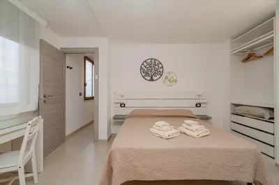 Letto o letti in una camera di Domo Le Mura Puniche, Centro di Olbia
