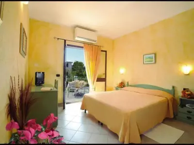 Letto o letti in una camera di Studio in Meernähe auf Sardinien