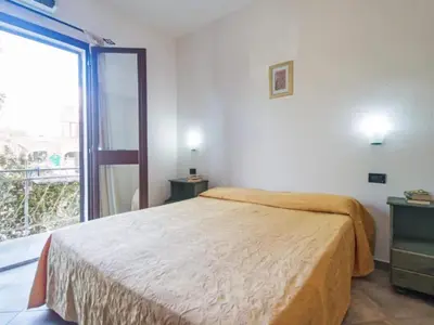 Letto o letti in una camera di Studio in Meernähe auf Sardinien